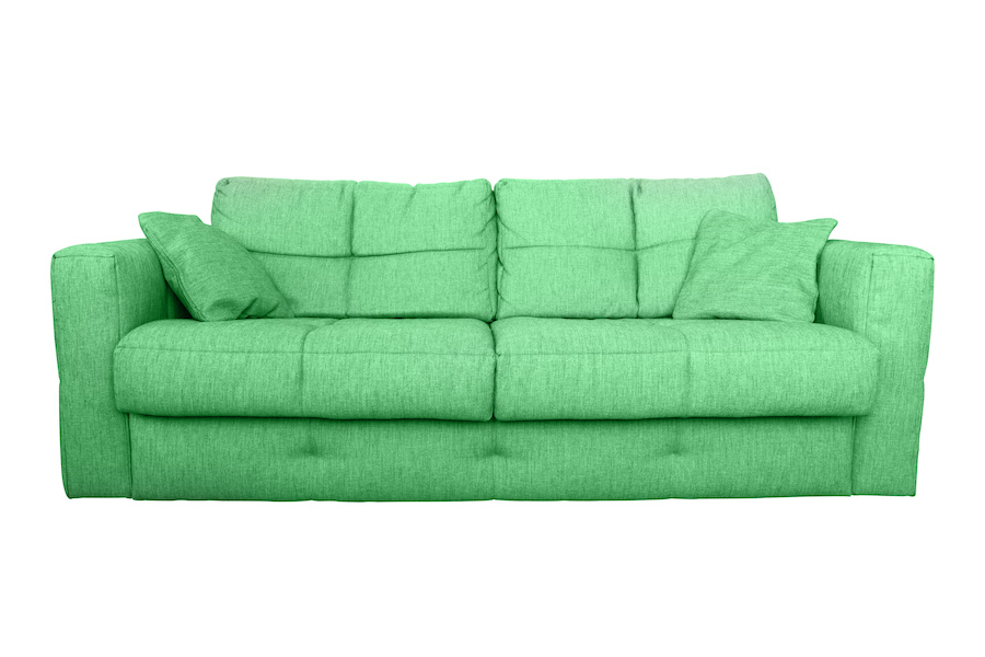 Modern green sofa or couch furniture isolated on white background