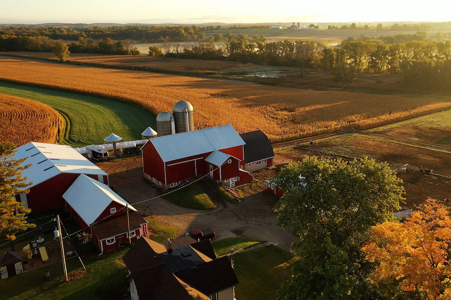 Countryside scenery at Fall season. Autumn colors. Harvest, harvesting time. Rural landscape. Aerial, view from above of the Farm