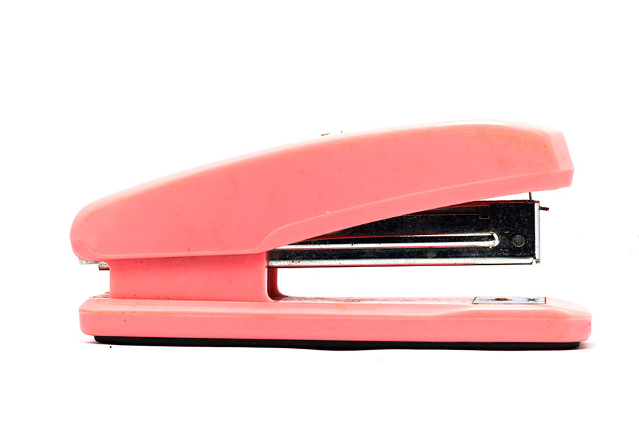 Pink Stapler on white background