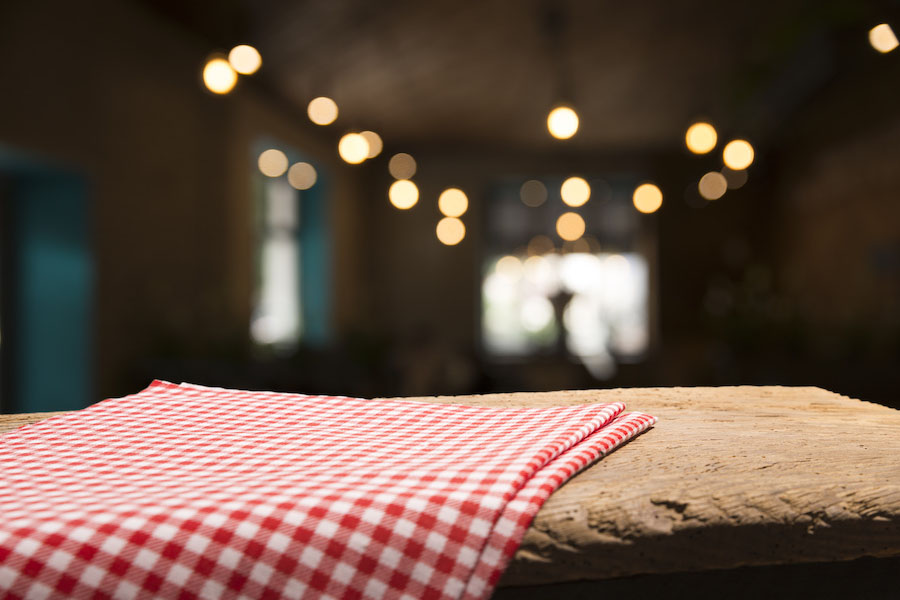 red tablecloth on wooden background empty deck